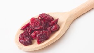 A quarter-cup daily serving of dried cranberries, part of the dried cranberries benefits portion guide