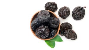 Fresh dried prunes showing the prunes health benefits of a natural digestive and bone-supporting snack